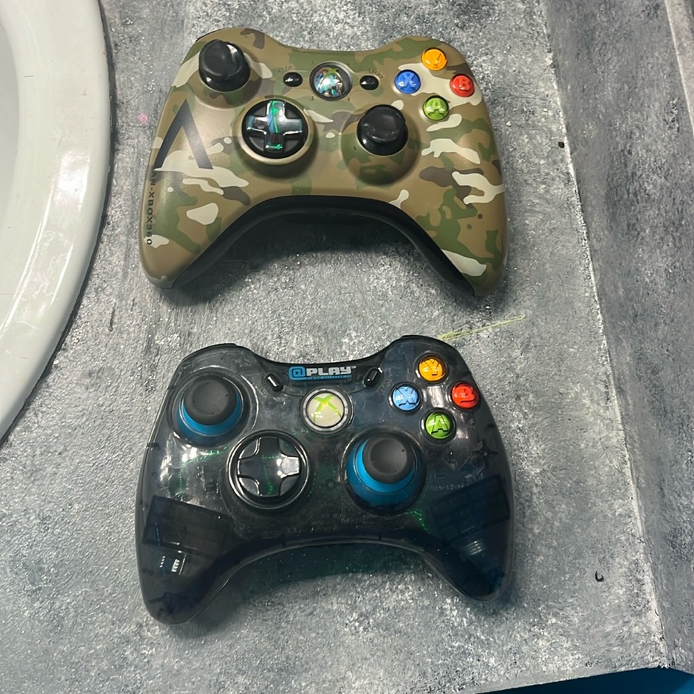 Xbox 360 Controllers one wired and other double A battery pack